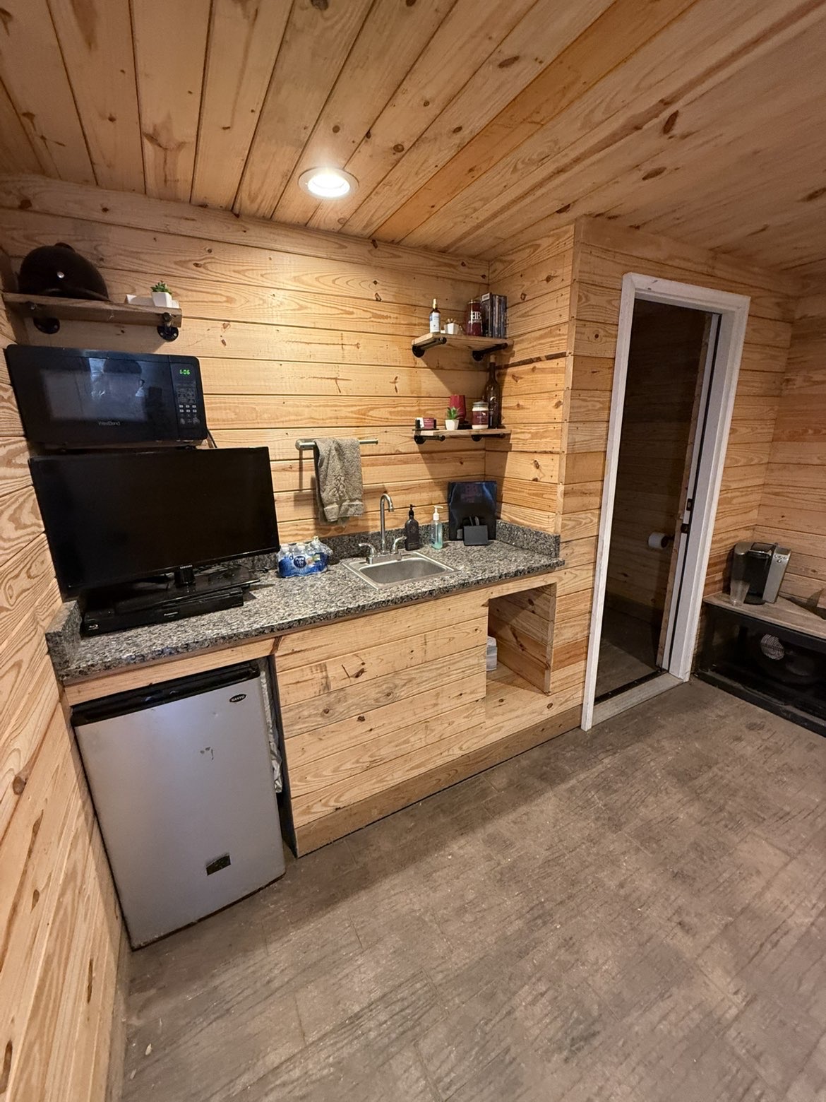 Lounge with Restroom, Couch, AC, and Fridge