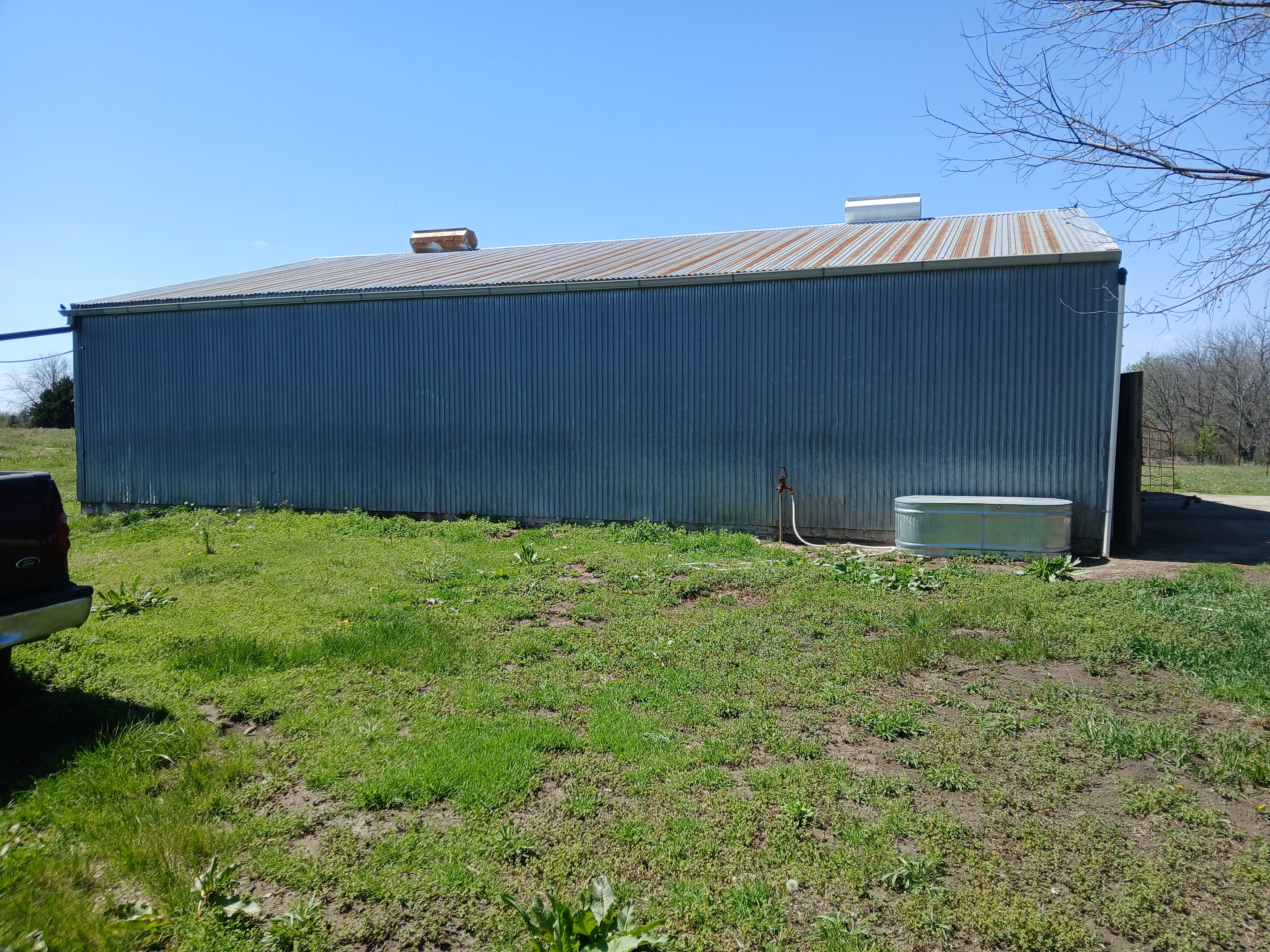 Side view of the barn with access to water hydrant by the barn