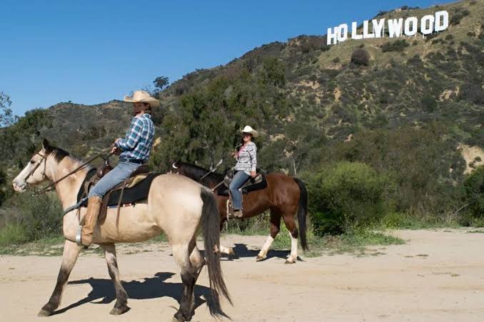 Riding under the Hollywood sign