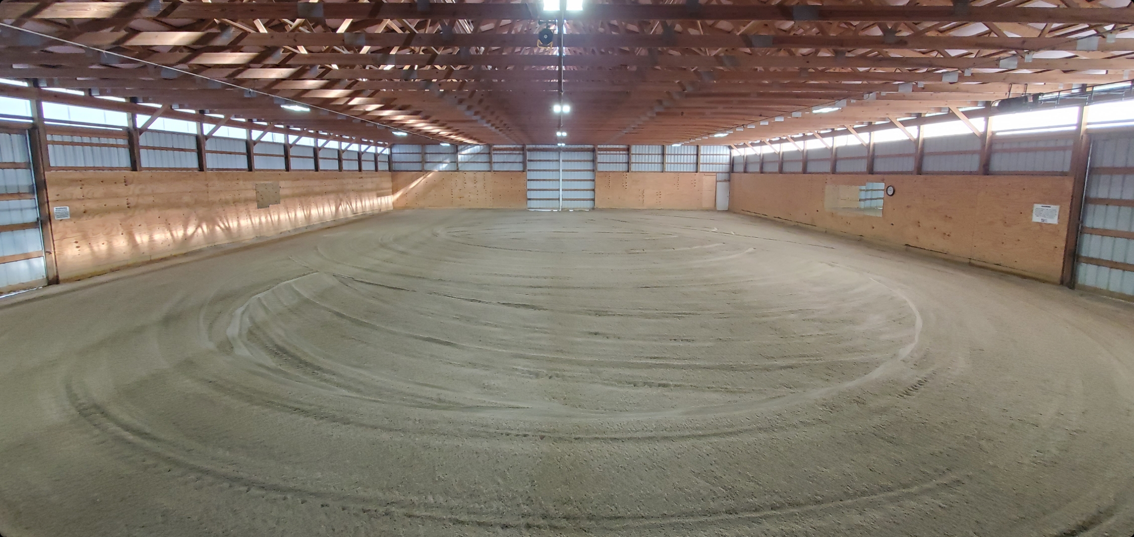 Large indoor arena with treated sand footing