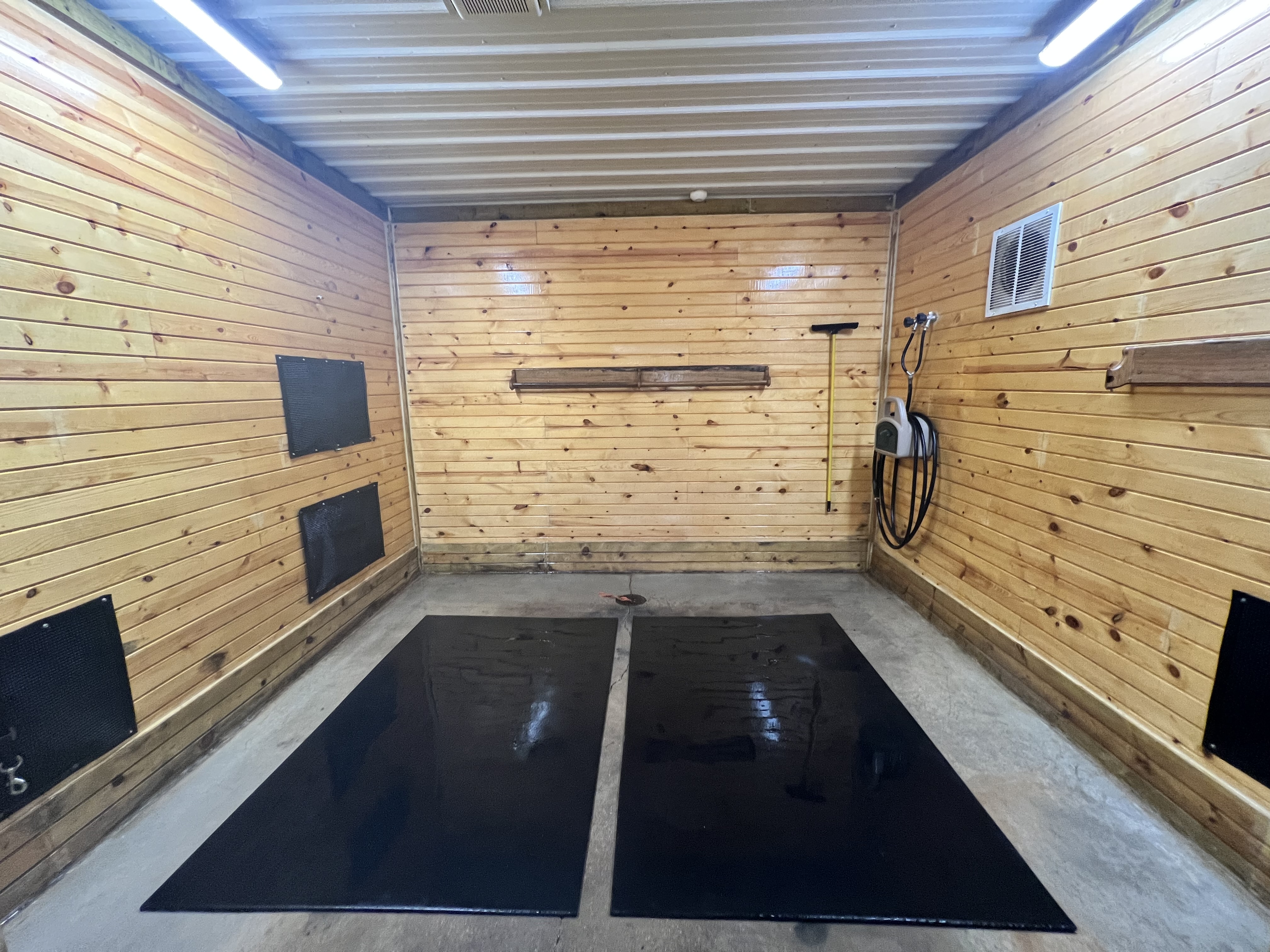 Indoor heated hot/cold water wash stall.