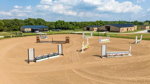 Our beautiful sandy loam outdoor arena, great for both English and Western disciplines.