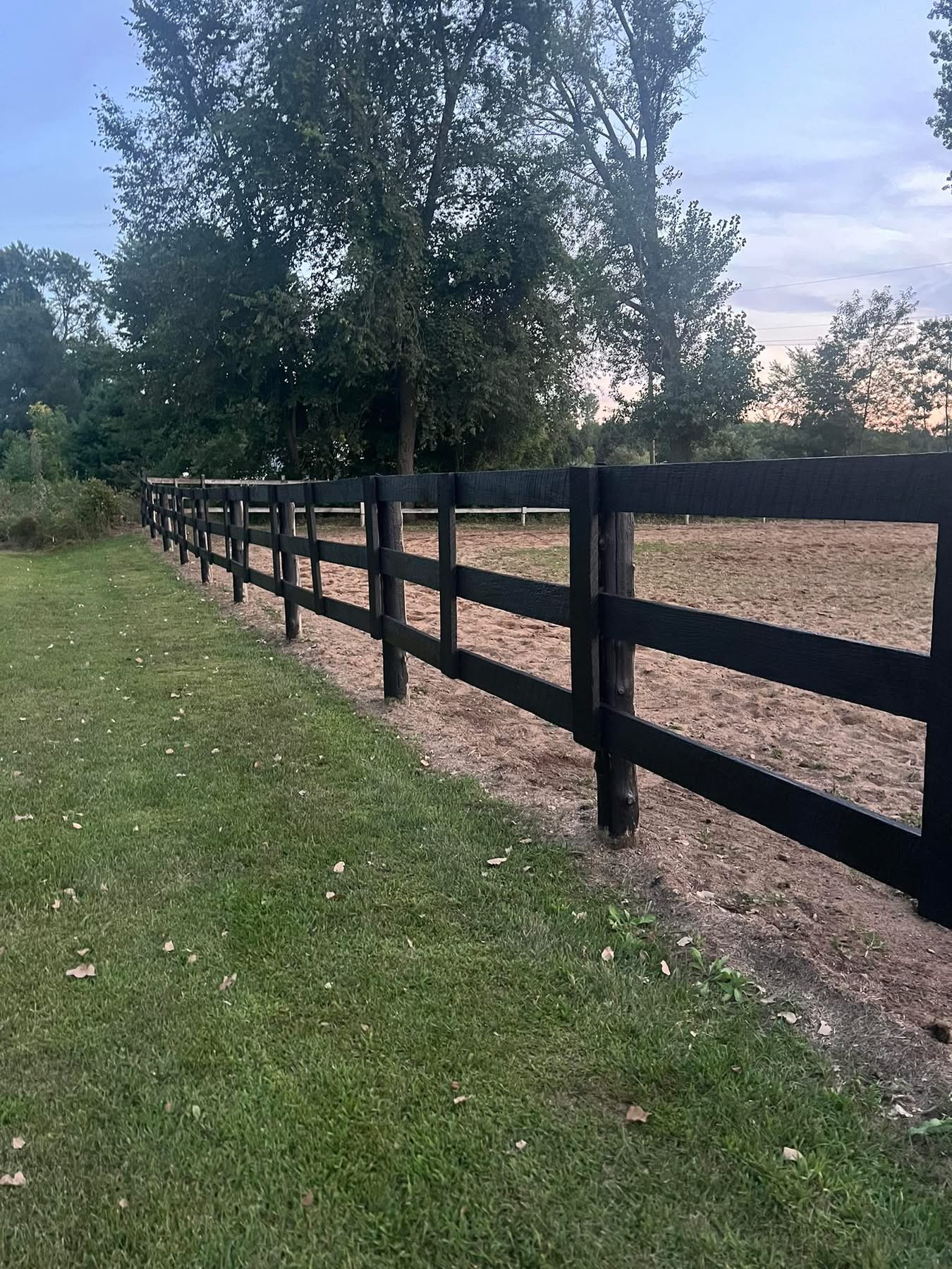 Wooden Fence that spans 90% of our property.
